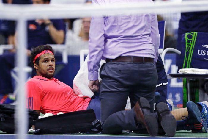 injured opponent. Jo-Wilfried Tsonga